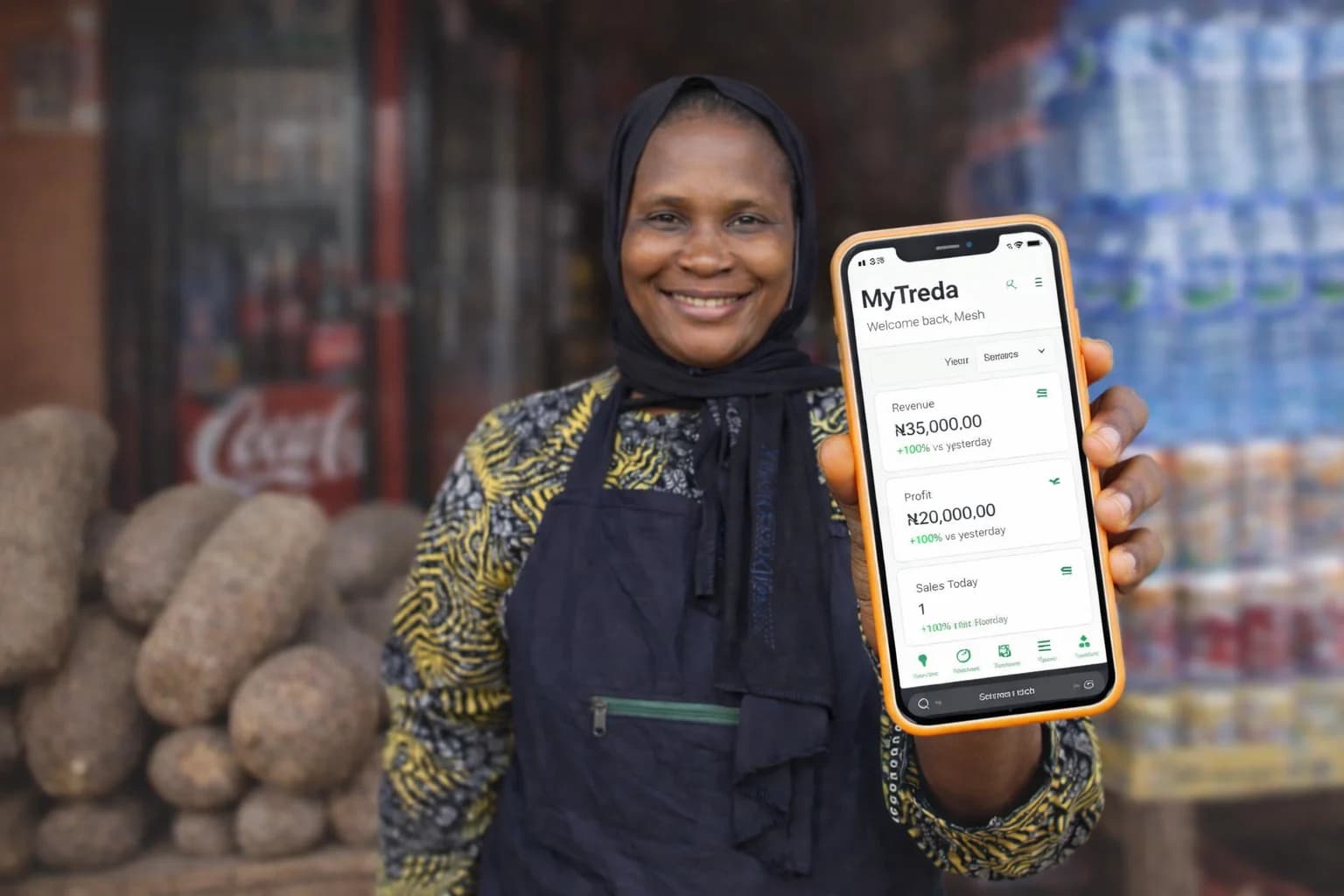 Nigerian trader using MyTreda inventory app on mobile phone